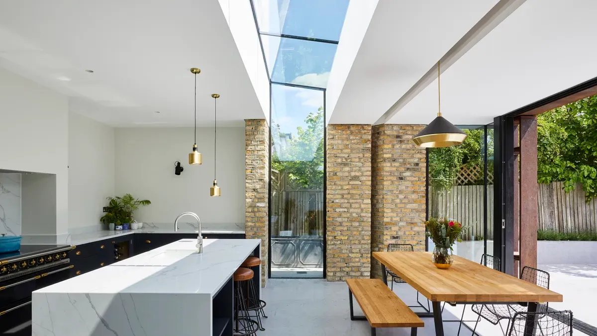 narrow kitchen with glass window on roof